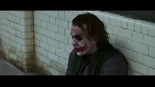 Joker's bloody face against brick wall — Batman: The Dark Knight