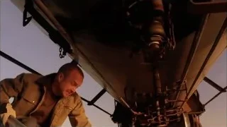 man working on aircraft underside — Breaking Bad