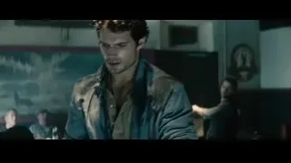 man in leather jacket in dimly lit room — Superman: Man of Steel