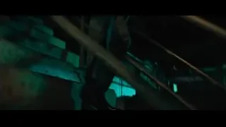 men walking up stairs in dark room — John Wick: Chapter 4