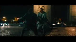 person lying on cobblestone street at night — John Wick: Chapter 4