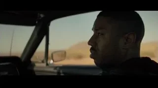 Person sitting on staircase in dark room — Creed 2