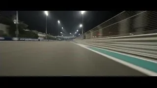 empty race track lit at night — F1