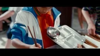 Young girl holding chopsticks with food — The Karate Kid