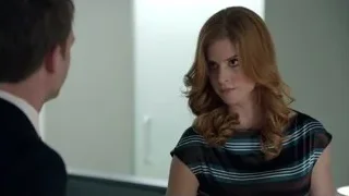 man and woman conversing in room — Suits