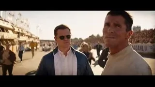 Two men speaking to a large crowd — Ford v Ferrari