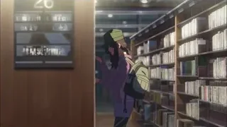 young man in library with book — Your Name