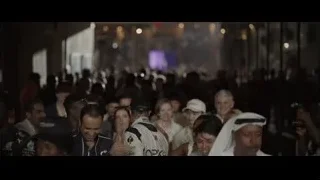 man in racing suit in large crowd — F1