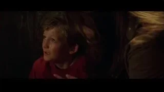 distressed boy with head in hands — Batman
