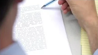 Hand writing on paper with pen — Suits