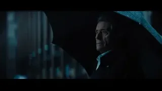 Man holding blue umbrella in dark room — John Wick: Chapter 4