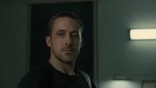 man's serious face in dim light — Blade Runner 2049