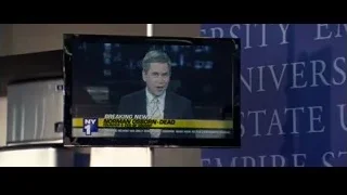 TV screen displaying breaking news headline — The Amazing Spider Man 2