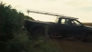 black pickup truck driving on dirt road — Interstellar