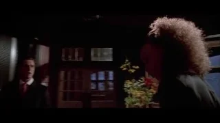 man and woman kissing by Christmas tree — American Psycho