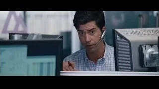 Man in blue suit smiling in office — The Big Short
