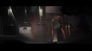 people standing by brick building at night — The Wolf Of Wall Street