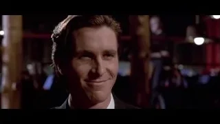 man's face in dimly lit bar — American Psycho