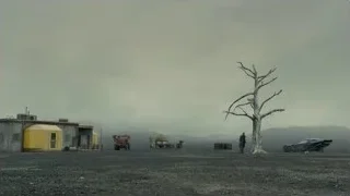 barren landscape with dead tree and building — Blade Runner 2049