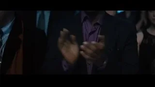 man smiling at a party — Creed 2