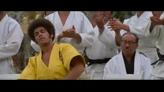Man in yellow karate uniform training — Bruce Lee: Enter The Dragon