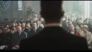 man speaking into microphone in church — Peaky Blinders