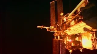 space station and tall building at night — Elon Musk: Return to Space