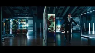 Man with gun in futuristic room — John Wick: Chapter 4