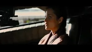 Young woman sitting in car looking out window — Batman: The Dark Knight Rises