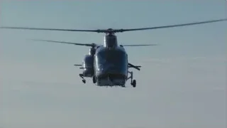 Blue helicopter flying in clear sky — Succession
