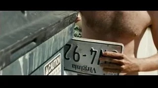 man holding metal plate with number — Into the Wild