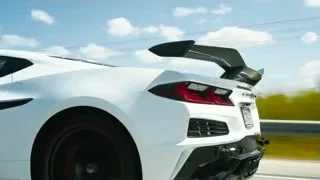 white sports car driving on highway — Sports Cars