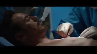 surgeon operating on man in hospital bed — Iron Man 3
