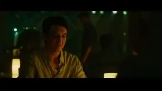 young man deep in thought at candlelit table — Whiplash