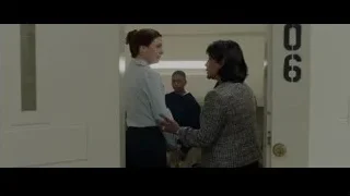 Two women conversing in hallway — Creed