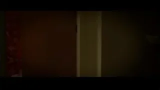 door in dark room with red curtain — Limitless