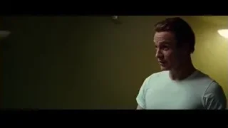 Man in blue t-shirt in dimly lit room — Steve Jobs