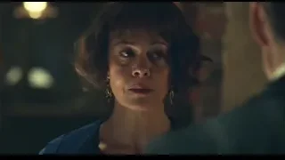 Woman with closed eyes, man in background — Peaky Blinders
