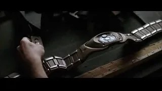 hands working on watch in workshop — Batman