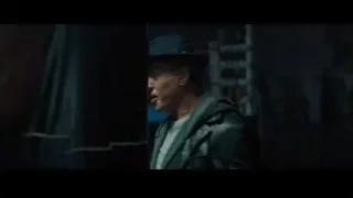 man standing in dimly lit boxing ring — Creed 2