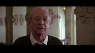 older man in suit in ornate room — Batman