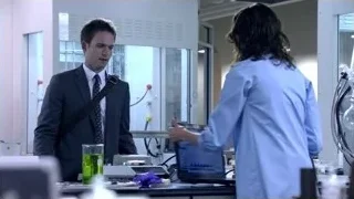 man and woman working in laboratory — Suits