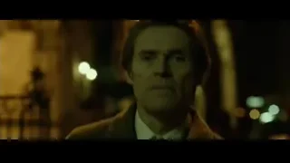 Man in suit deep in thought in dimly lit room — John Wick