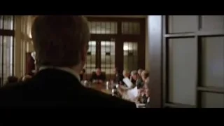 Man in suit giving presentation — Batman