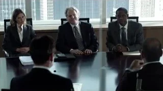four people conversing in conference room — Suits