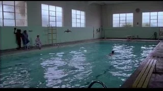 people swimming and diving in indoor pool — Rocky III