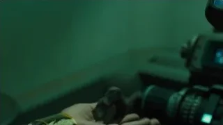 hand holding object in front of camera — Blade Runner 2049