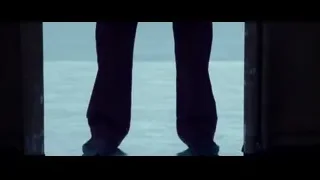 shirtless man with black lines in dark room — Deadpool 2