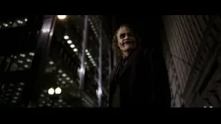 Joker standing in dark alleyway at night — Batman: The Dark Knight