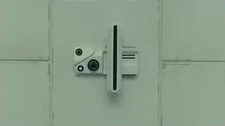 white door handle on tiled wall — Blade Runner 2049